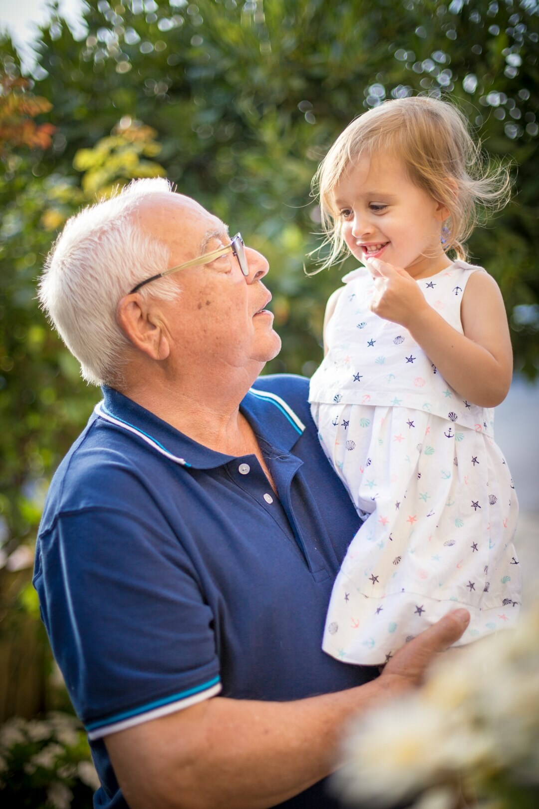 Elderly Danish grandfather telling a story to his grandchildren