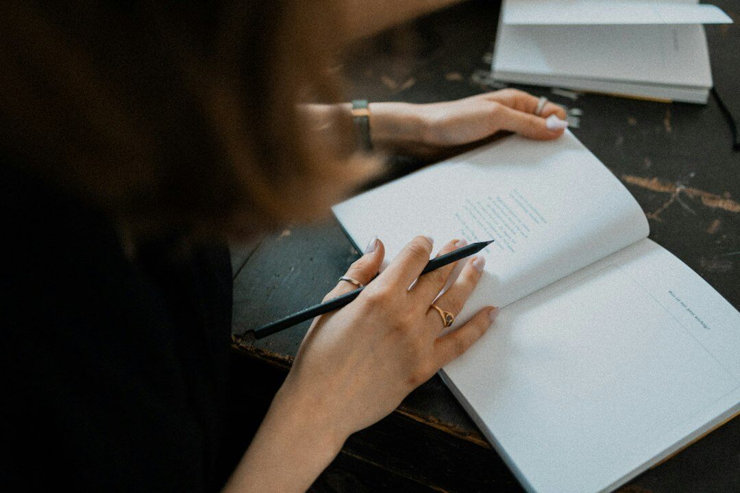 Danish editor reviewing a printed manuscript at an office desk