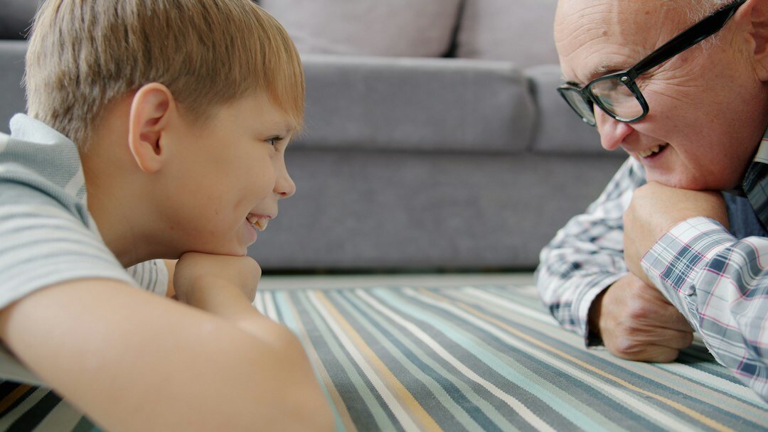Danish multigenerational family talking together in a bright living room